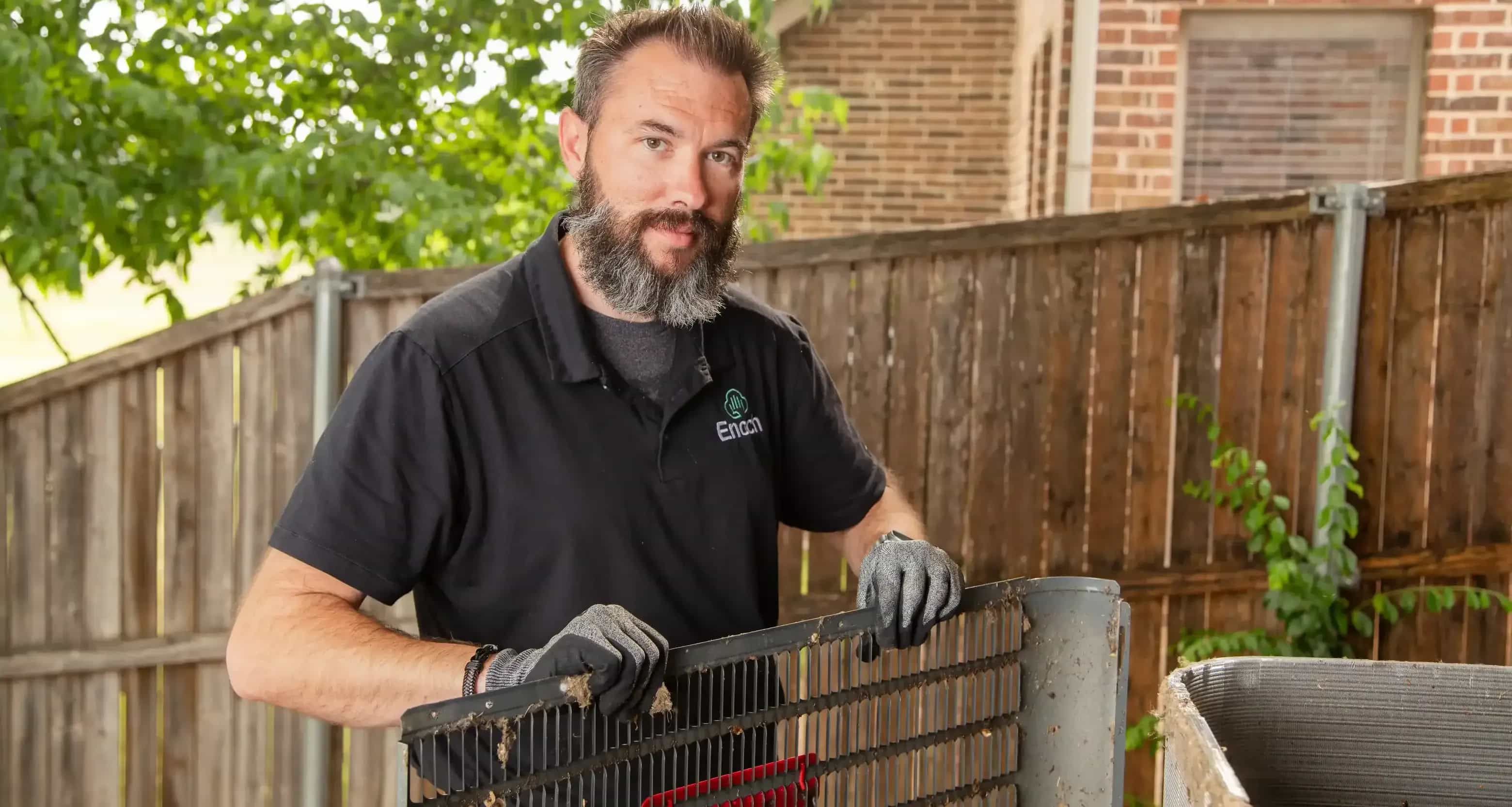 Team Enoch technician replacing HVAC filters
